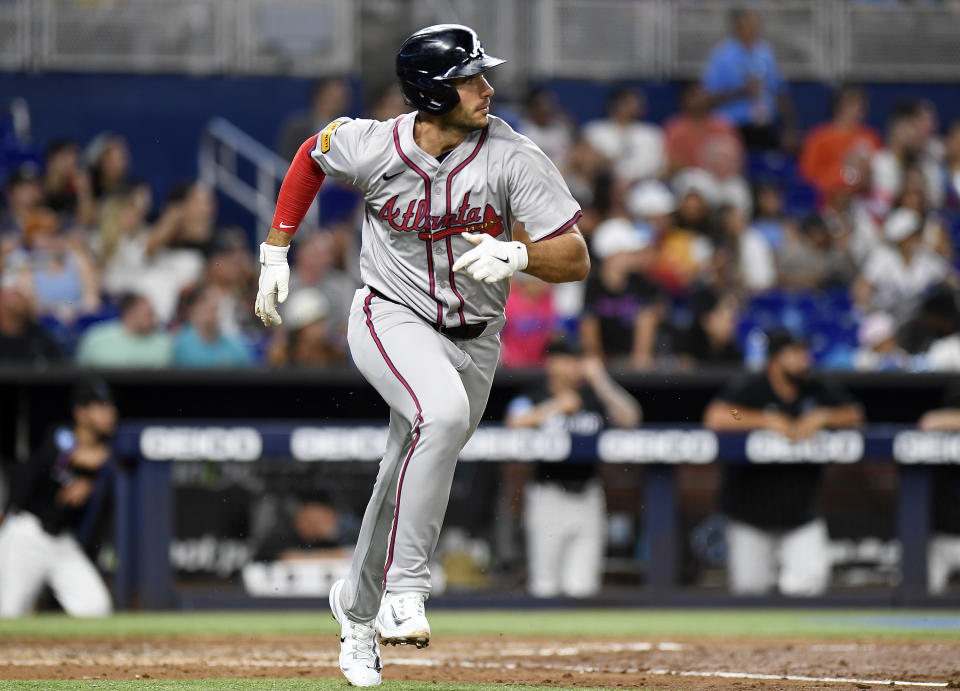 Atlanta Braves Matt Olson hits a double during the sixth inning of a baseball game against the Miami Marlins, Friday, April 12, 2024, in Miami. (AP Photo/Michael Laughlin)