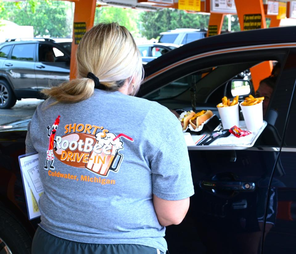 The food comes on trays that hang from the car windows.