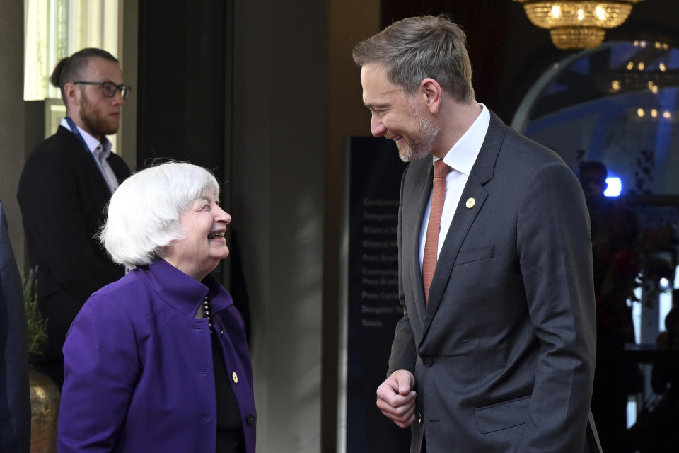 German Finance Minister Christian Lindner, right, welcomes U.S. Treasury Secretary Janet Yellen, front left, for a G7 Finance Ministers Meeting at the federal guest house Petersberg, near Bonn, Germany, Thursday, May 19, 2022. (Federico Gambarini/dpa via AP)