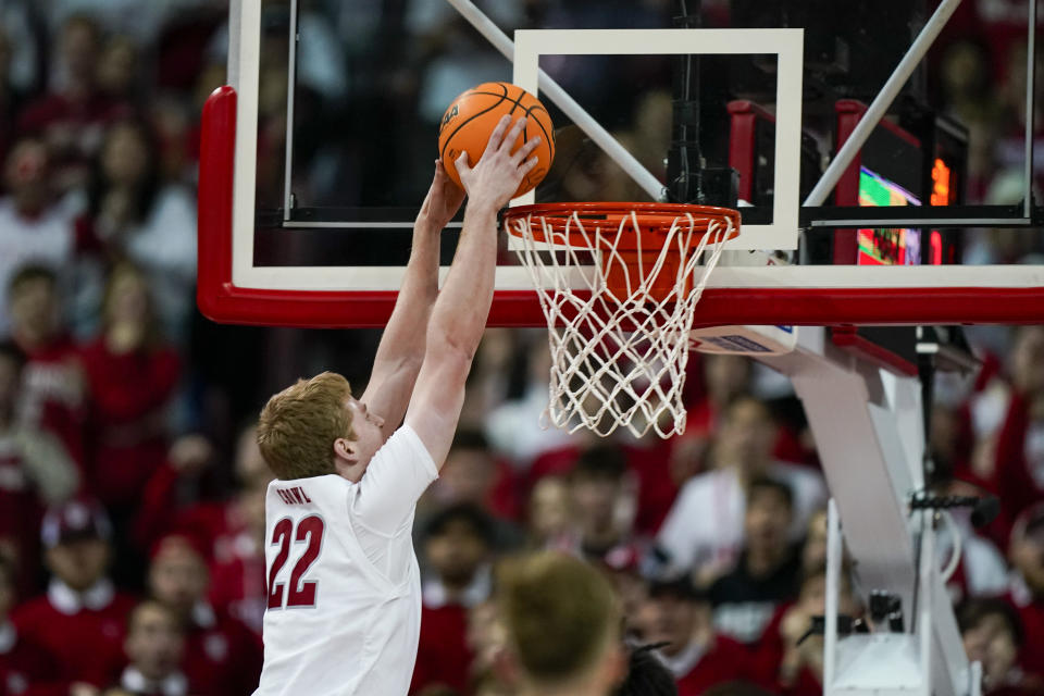 Wisconsin's Steven Crowl (22) dunks against Purdue during the first half of an NCAA college basketball game Sunday, Feb. 4, 2024, in Madison, Wis. (AP Photo/Andy Manis)