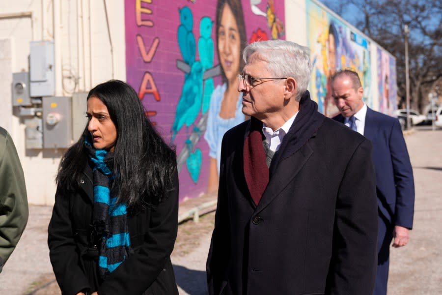 Attorney General Merrick Garland, right, and Associate Attorney General Vanita Gupta, left,tour of murals of shooting victims, Wednesday, Jan. 17, 2024, in Uvalde, Texas. The Justice Department is planning this week to release findings of an investigation into the 2022 school shooting. (AP Photo/Eric Gay)