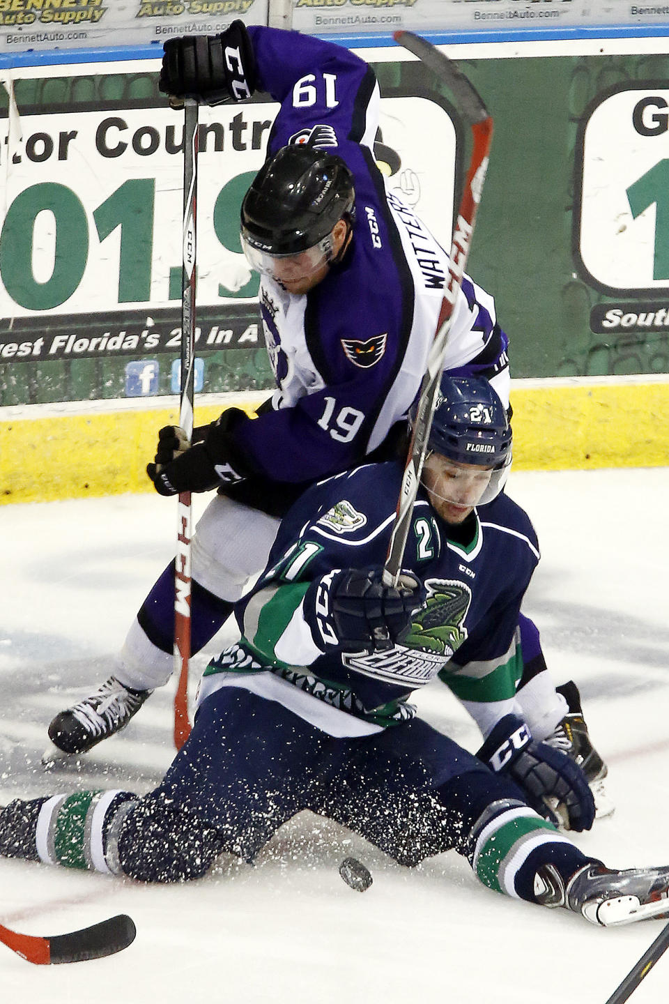 FILE - In this April 1, 2015, file photo, Florida Everblades' Spencer Pommells, bottom, is pressured by Reading Royals' Ian Watters (19) duirng the third period of an ECHL hockey game in Estero, Fla. The ECHL season was canceled because of the coronavirus pandemic. (AP Photo/Naples Daily News, Core Perrine)