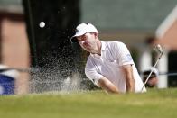 Nick Taylor, of Canada, hits out of a bunker on the third hole during the second round of the Charles Schwab Challenge golf tournament at the Colonial Country Club, Friday, May 27, 2022, in Fort Worth, Texas. (AP Photo/LM Otero)