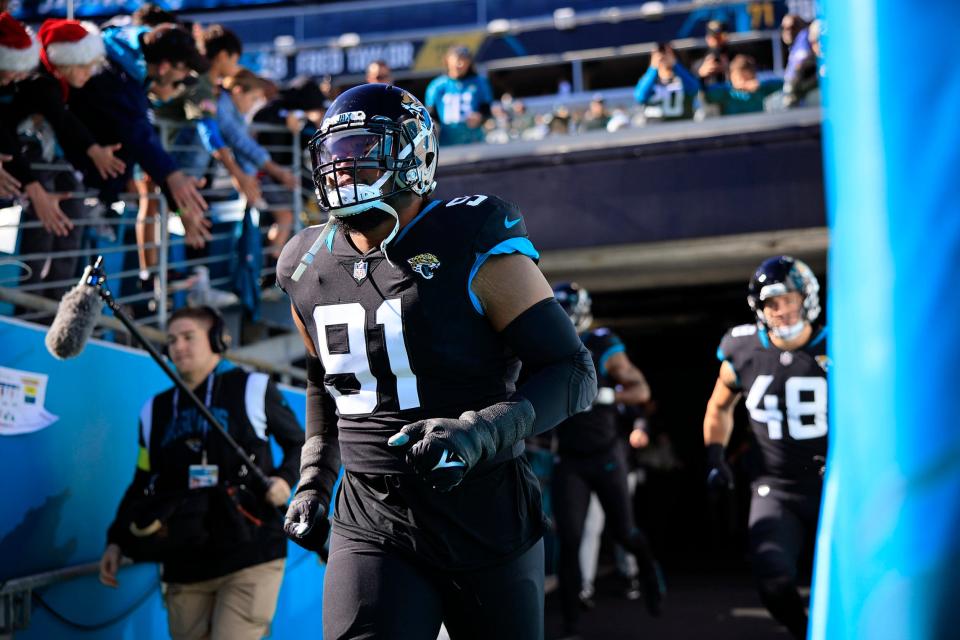 Jacksonville Jaguars defensive end Dawuane Smoot (91) takes to the field before a regular season NFL football matchup between the Jacksonville Jaguars and the Dallas Cowboys Sunday, Dec. 18, 2022 at TIAA Bank Field in Jacksonville. The Jacksonville Jaguars edged the Dallas Cowboys 40-34 in overtime. [Corey Perrine/Florida Times-Union]