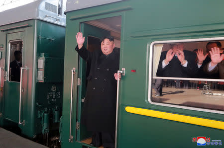 North Korean leader Kim Jong Un waves from a train as he departs for a summit in Hanoi, in Pyongyang, North Korea in this photo released by North Korea's Korean Central News Agency (KCNA) on February 23, 2019. KCNA via REUTERS