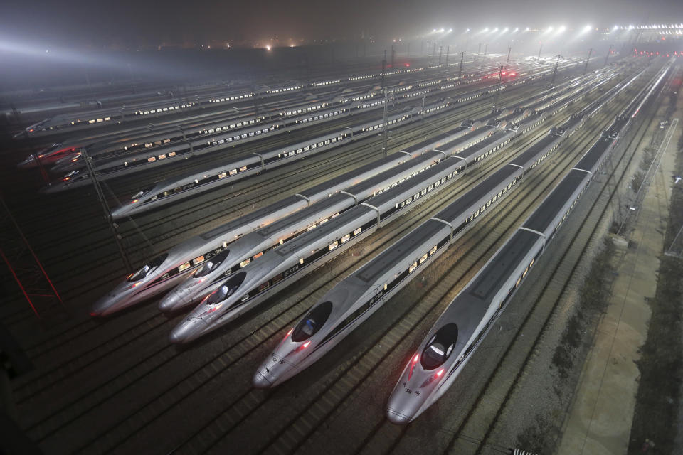 CRH380 (China Railway High-speed) Harmony bullet trains are seen at a high-speed train maintenance base in Wuhan, Hubei province, early December 25, 2012.