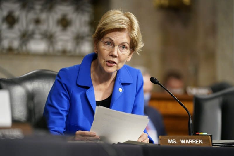 Sen. Elizabeth Warren, D-Mass., (pictured on Capitol Hill in 2021) and 13 members of Congress have called on regulators to block a proposed merger between financial giants Capital One and Discover. File Pool Photo by Patrick Semansky/UPI