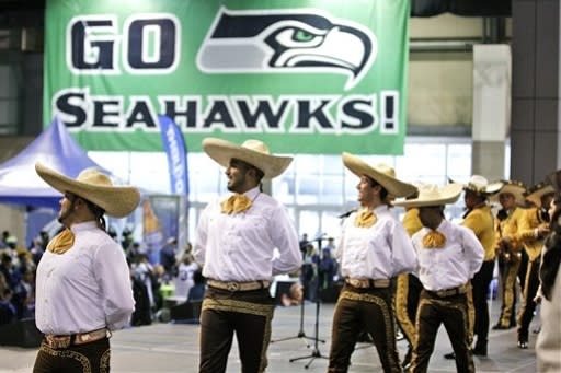 Dancers perform with Mariachi Guadalajara de Seattle at Touchdown City as part of the NFL celebration of Hispanic Heritage Month before an NFL football game between the Green Bay Packers and the Seattle Seahawks, Monday, Sept. 24, 2012, in Seattle. (AP Photo/Ted S. Warren)