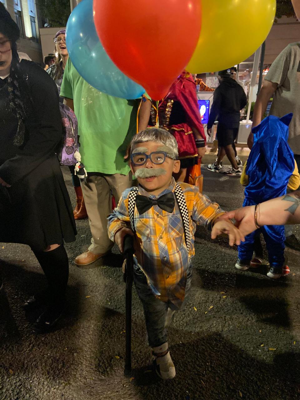 Youth costume contest winner, Ezra Kashansky, 3, is dressed as the Old Man from Disney Pixar's "Up" during the Halloween Block Party on Friday in downtown Hagerstown..