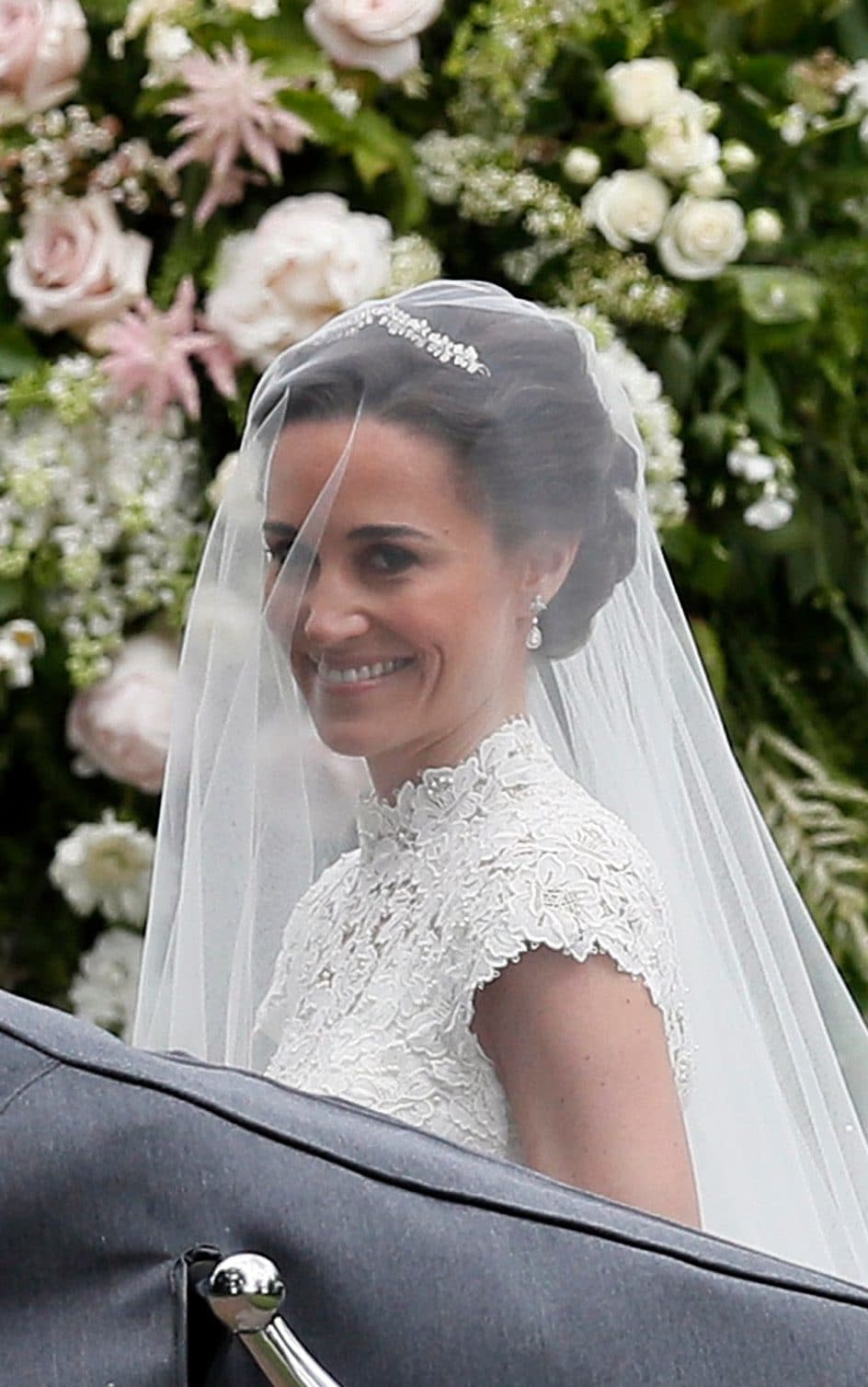 Pippa Middleton arrives at St Mark's Church in Englefield, wearing the diamond Robinson Pelham earrings commissioned for her sister the Duchess of Cambridge's wedding in 2011  - AP POOL