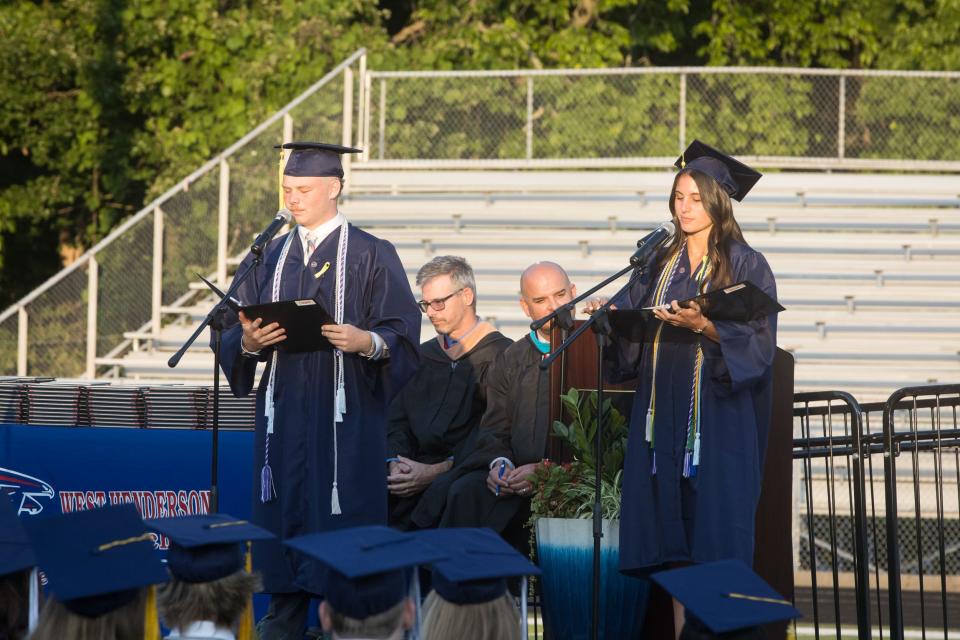 Senior Class President Cooper Hughes and Student Body President Jesse Jakubielski welcomes everyone to West Henderson's graduation ceremony Friday night at Johnson Field. [PAT SHRADER/ SPECIAL TO THE TIMES-NEWS]