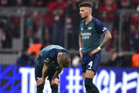 Arsenal's Martin Odegaard, left, and Arsenal's Ben White react disappointed after the Champions League quarter final second leg soccer match between Bayern Munich and Arsenal at the Allianz Arena in Munich, Germany, Wednesday, April 17, 2024. (AP Photo/Christian Bruna)