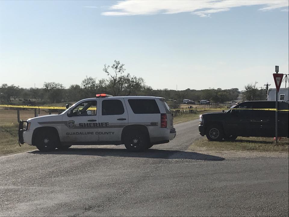 Police block a road in Sutherland Springs, Texas, after a gunman shot dozens of people at a nearby church on Sunday.&nbsp;Sutherland Springs is located about 35 miles east of San Antonio.&nbsp; (Photo: SUZANNE CORDEIRO via Getty Images)