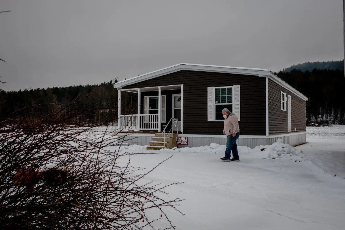 After decades, Biden plans to make mobile homes greener. But it's sparked a fierce debate.