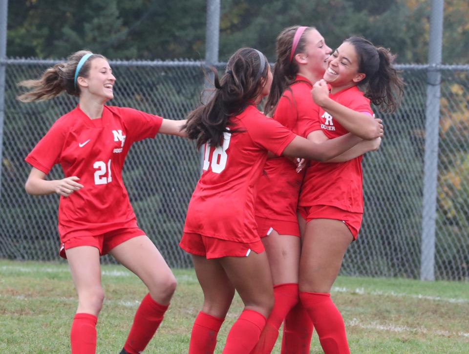 North Rockland's Gianna Piscopiello, far right, celebrates her goal during a Section 1 Class AA quarterfinal with New Rochelle at North Rockland Oct. 24, 2022. North Rockland advances on penalty kicks 3-2, after the teams tied 1-1.