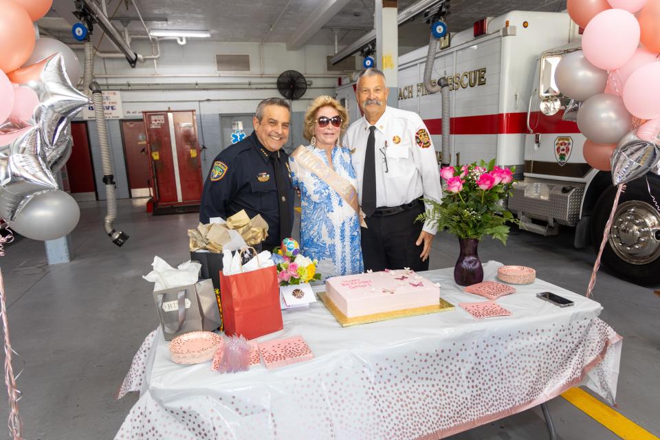 Eileen "Gogo" Burns with Police Chief Nicholas Caristo and Fire Rescue Chief Darrel Donatto.