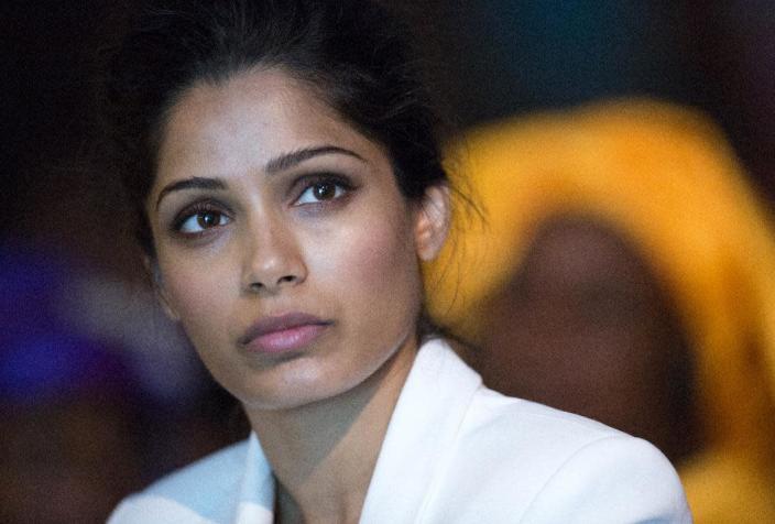 Indian actress and Plan International Girls' Rights Ambassador Freida Pinto listens to speakers at the 'Girl Summit 2014' at Walworth Academy in south London on July 22, 2014 (AFP Photo/Oli Scarff)