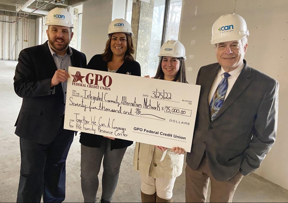 ICAN CEO/Executive Director Steven Bulger, left, is joined by GPO Federal Credit Union representatives, from left, Vice President of Marketing and Business Development Courtney Walchusky, Community Relations Coordinator Alycia Schick and President/CEO Nicholas Mayhew on the second floor of the Family Resource Center.