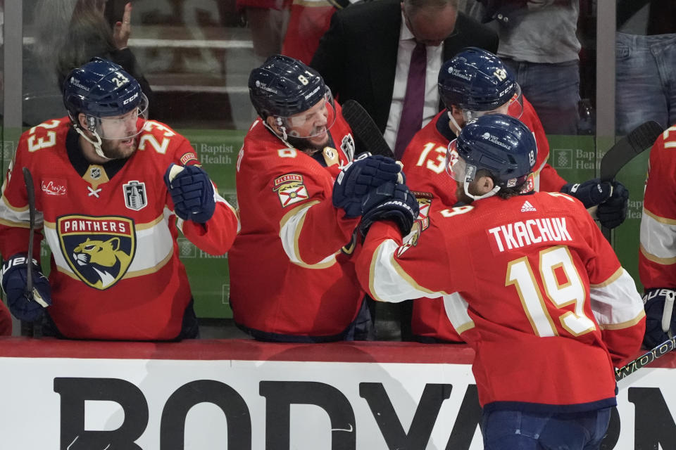 Florida Panthers left wing Matthew Tkachuk (19) is congratulated by teammates after scoring a goal during the second period of Game 5 of the NHL hockey Stanley Cup Finals against the Edmonton Oilers, Tuesday, June 18, 2024, in Sunrise, Fla. (AP Photo/Rebecca Blackwell)