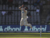 New Zealand's Ajaz Patel try to catch the ball during the day two of their second test cricket match with India in Mumbai, India, Saturday, Dec. 4, 2021.(AP Photo/Rafiq Maqbool)