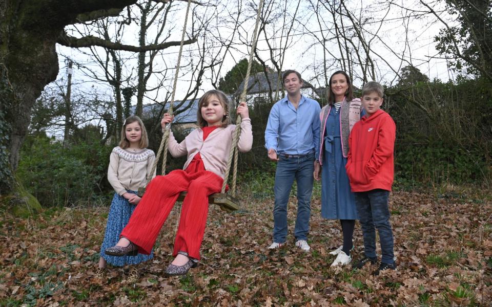 Pix show Jo Saunders, her husband Charlie Saunders and children Max (11, in red fleece),Molly (8, in blue skirt) and Mary (5, in red trousers) at their country home in Cove, Devon.Pix Jay Williams 15-02-23 - Jay Williams