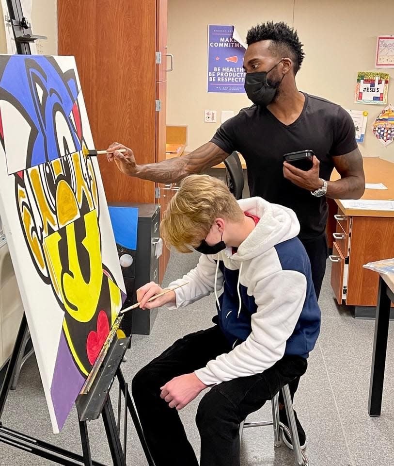 Tysen Knight demonstrates his passion for art mentoring.