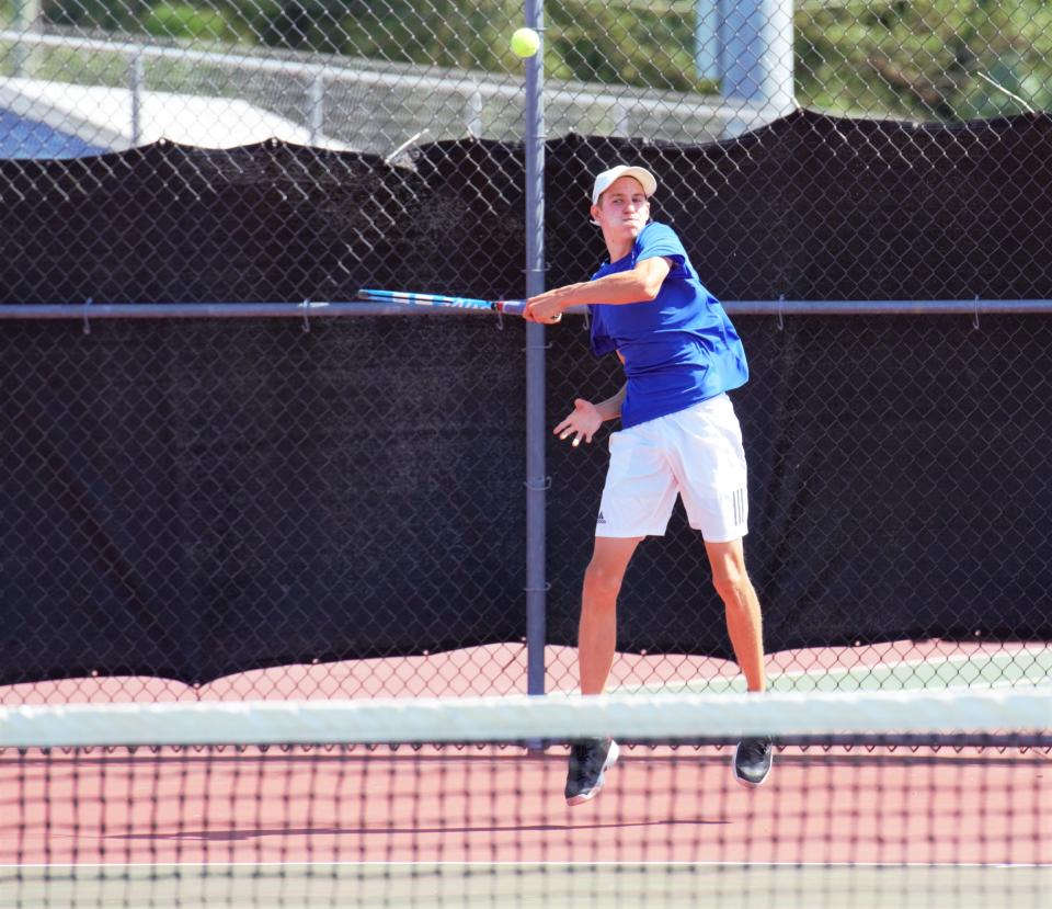 Martin County's Dylan de Windt hits a return during a 3A regional semifinal tennis match at Martin County High School on Tuesday, Apr. 19, 2022. The Tigers won 4-1 to advance in the state tournament.