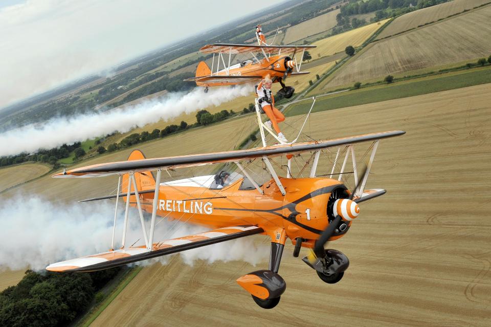 Nine-year-old cousins Rose Powell (front) and Flame Brewer wingwalking over Rendcomb Airfield near Cirencester for the charity Duchenne Children's Trust, becoming the World's youngest formation wingwalkers.