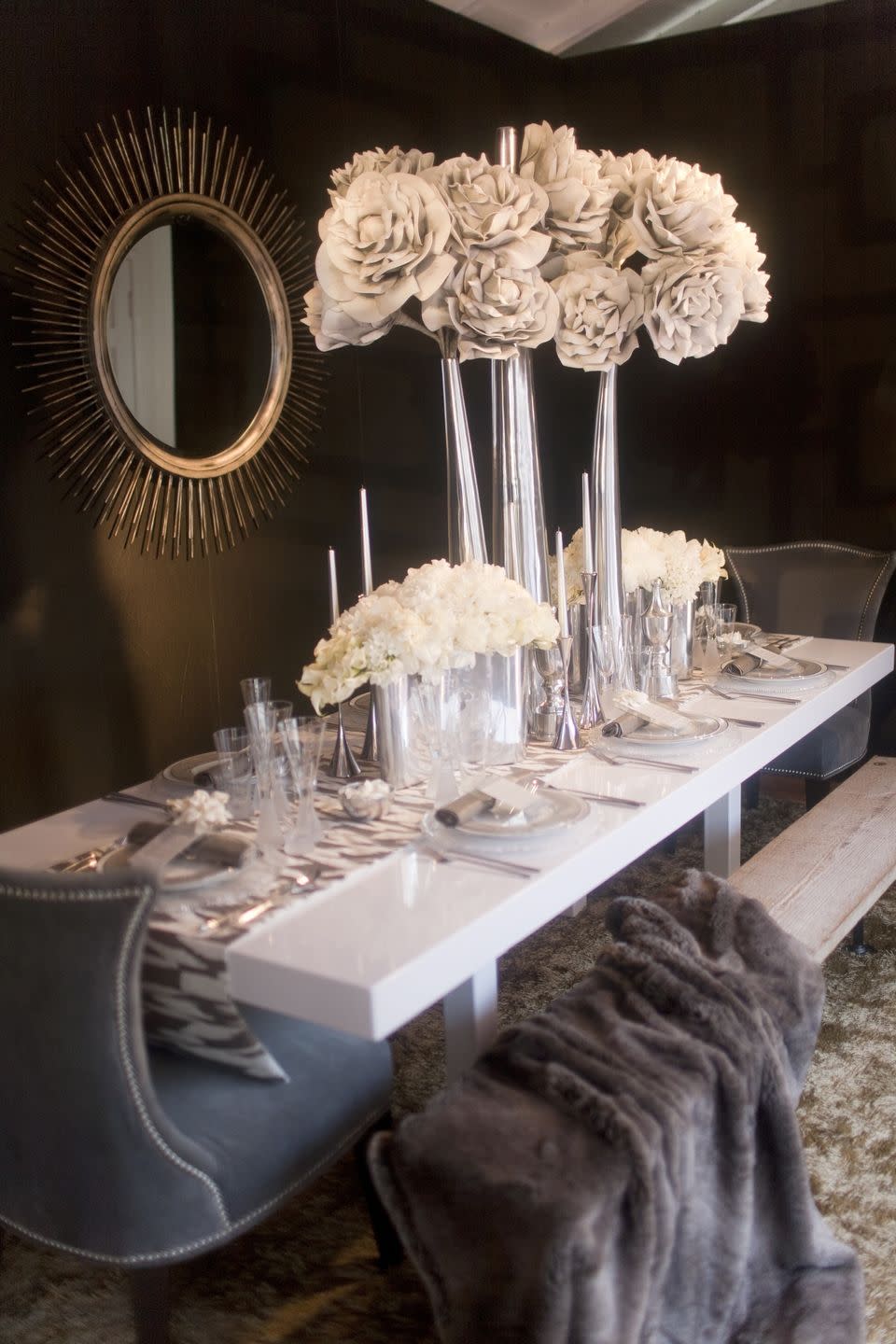 <p>Tall centerpiece vases aren’t just for weddings. Place large, white blooms in tall silver vases for a centerpiece that’s frosted with the colors of a snowy winter. Side note: A furry throw on the chairs or benches will complement this design with a breath of warmth. </p><p><em>Via <a href="http://www.sterlingsocial.com/" rel="nofollow noopener" target="_blank" data-ylk="slk:Sterling Social;elm:context_link;itc:0;sec:content-canvas" class="link ">Sterling Social</a></em></p>