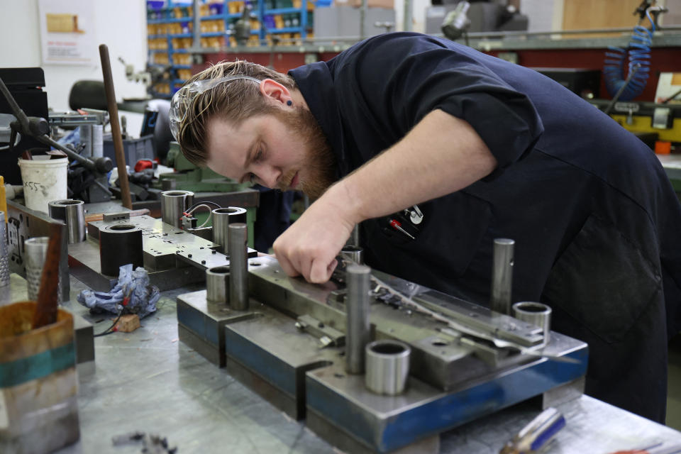 UK manufacturing: A worker in a factory processes new orders 