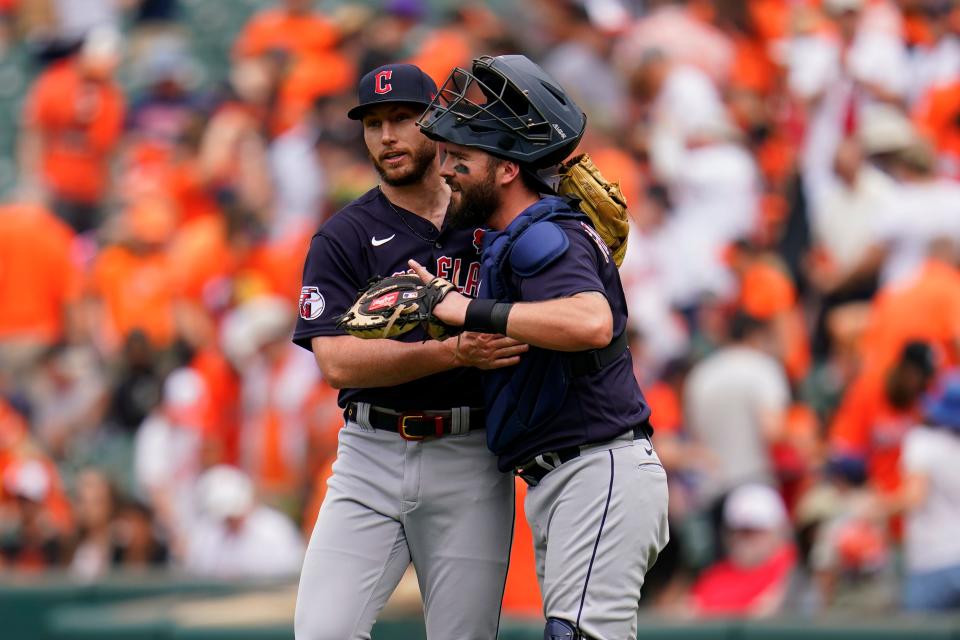 Cleveland Guardians relief pitcher Trevor Stephan, left, and catcher Cam Gallagher react after a baseball game against the Baltimore Orioles, Monday, May 29, 2023, in Baltimore. The Guardians won 5-0. (AP Photo/Julio Cortez)