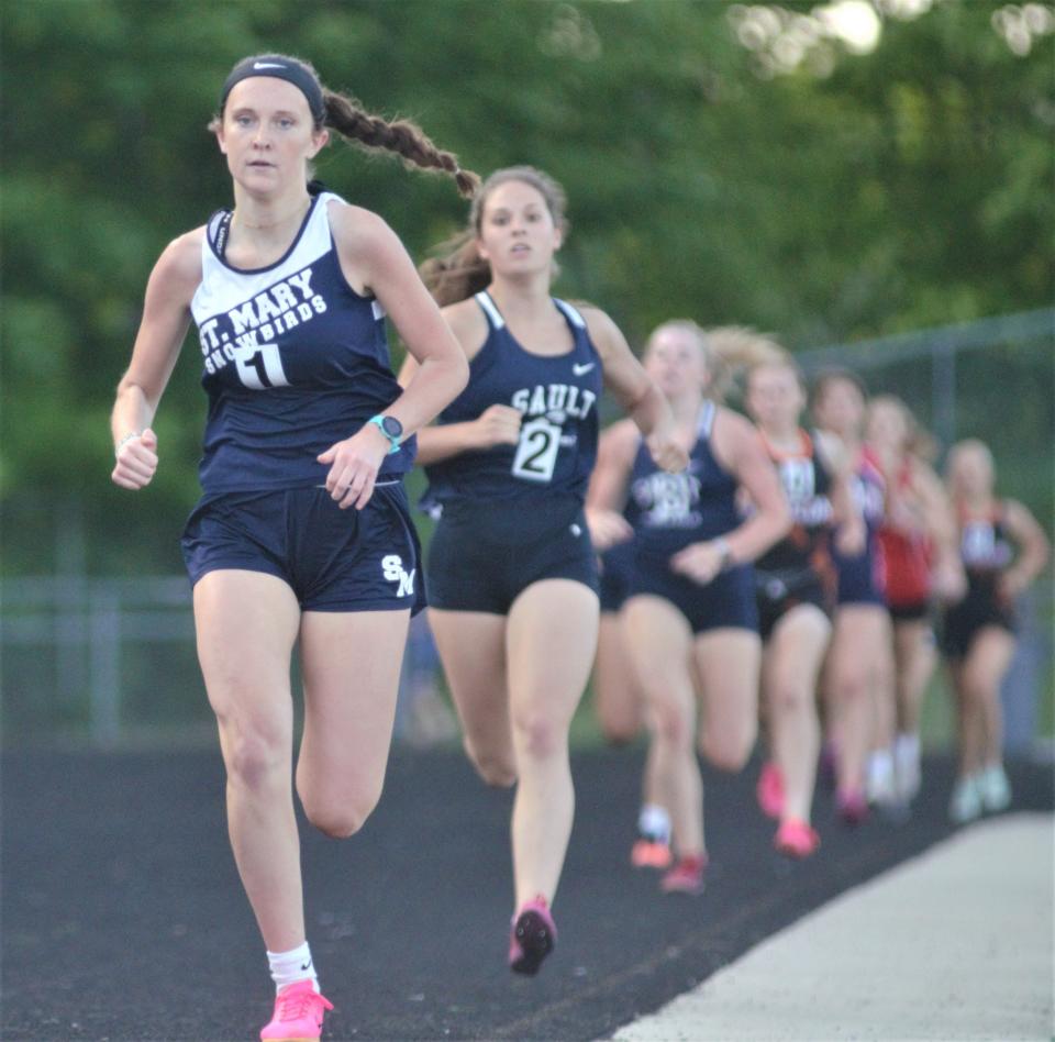 Miriam Murrell leads a group of runners in the 800-meter run during the Northern Michigan Meet of Champions on Tuesday, May 30 in Gaylord, Mich.