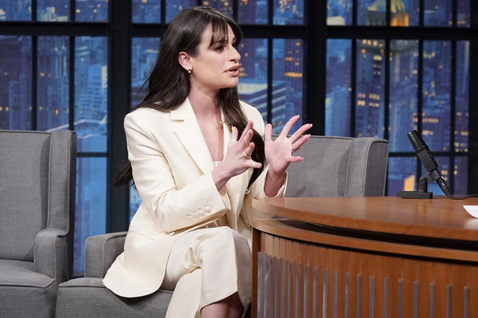 LATE NIGHT WITH SETH MEYERS -- Episode 1362 -- Pictured: (l-r) Actress/singer Lea Michele during an interview with host Seth Meyers on December 5, 2022 -- (Photo by: Lloyd Bishop/NBC)