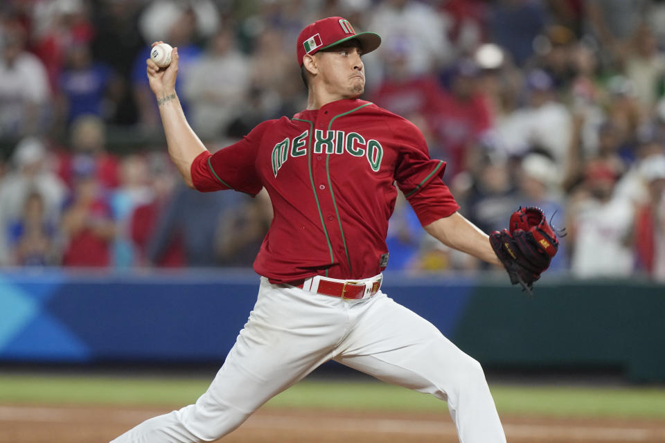 Mexico pitcher Giovanny Gallegos aims a pitch during the ninth inning of a World Baseball Classic game against Puerto Rico, Friday, March 17, 2023, in Miami. Mexico defeated Puerto Rico 5-4. (AP Photo/Marta Lavandier)