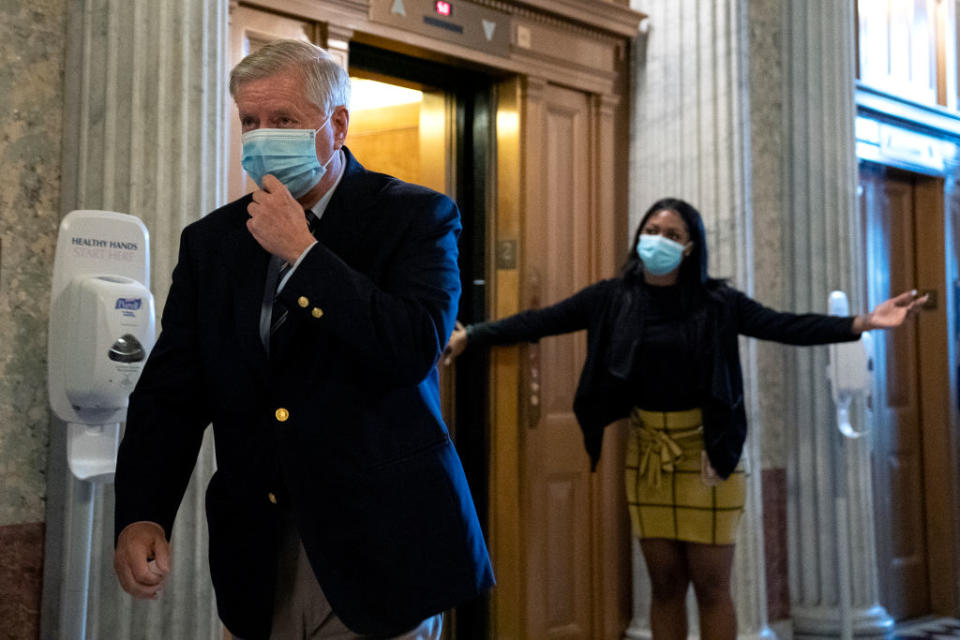 U.S. Sen. Lindsey Graham (R-SC) walks to the Senate floor at the U.S. Capitol on Wednesday in Washington, DC. The White House is hoping to reach a deal on a COVID-19 stimulus package in the next two days, after Senate Democrats blocked a $500 billion bill Wednesday afternoon. (Photo by Stefani Reynolds/Getty Images)