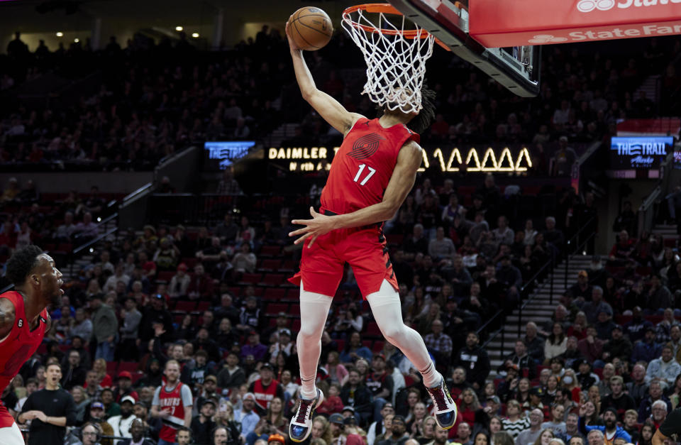 Portland Trail Blazers guard Shaedon Sharpe (17) dunks against the Oklahoma City Thunder during the second half of an NBA basketball game in Portland, Ore., Sunday, March 26, 2023. (AP Photo/Craig Mitchelldyer)
