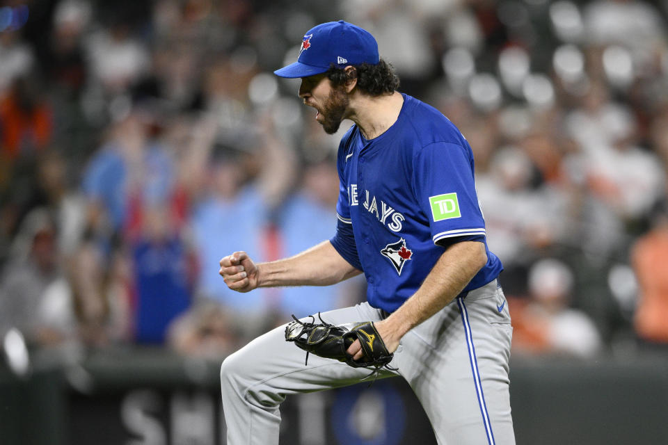 Toronto Blue Jays relief pitcher Jordan Romano starts to celebrate at the end of a baseball game against the Baltimore Orioles, Monday, May 13, 2024, in Baltimore. (AP Photo/Nick Wass)