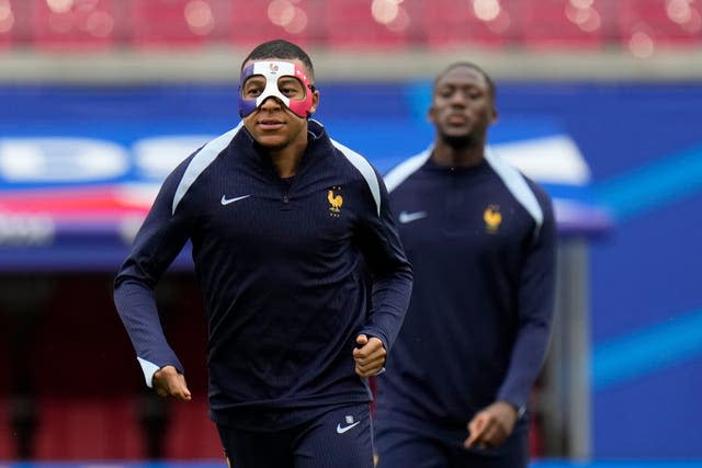 France’s Kylian Mbappe wearing a face mask as he trains in Leipzig on Thursday