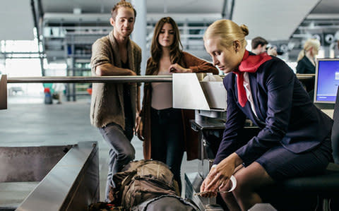 While your checked bags are always weighed, airline crew (depending on the carrier) are less strict about weighing carry-on bags - Credit: Getty