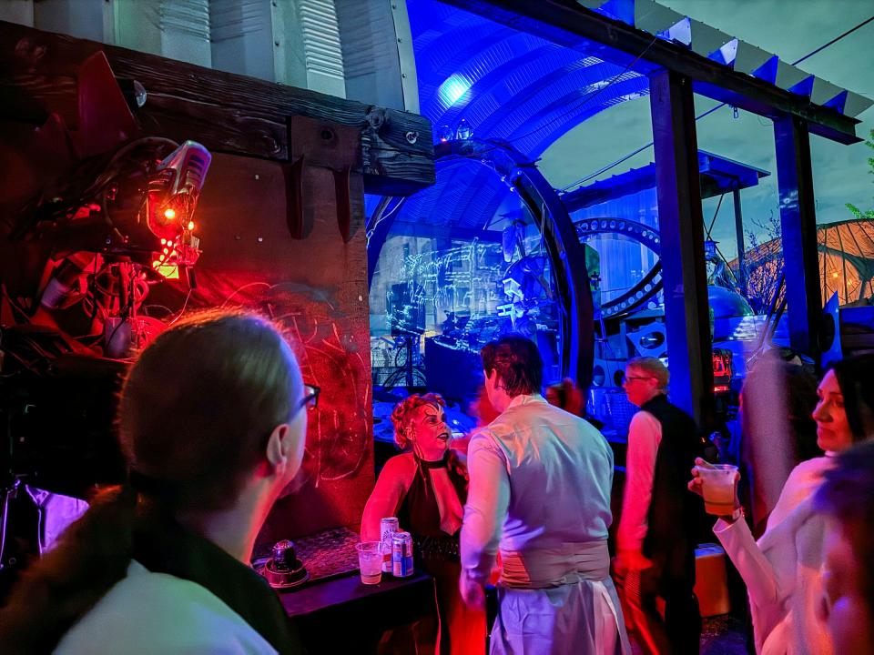 Crowds gather around one of the stages where droids perform during the Space Dive 313 party, set on the planet of Tatooine in the "Star Wars" galaxy, six months after the Death Star is destroyed at Tangent Gallery in Detroit on Saturday, May 4, 2024.