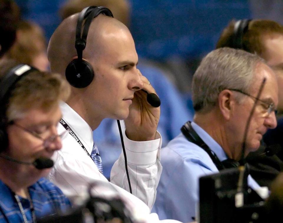 Former North Carolina center Eric Montross (center, left) prepares to broadcast with Woody Durham (center, right) prior to the start of the North Carolina-Florida State ACC tournament quarterfinal game at St. Pete Times Forum in Tampa DAVID T. FOSTER III/File photo