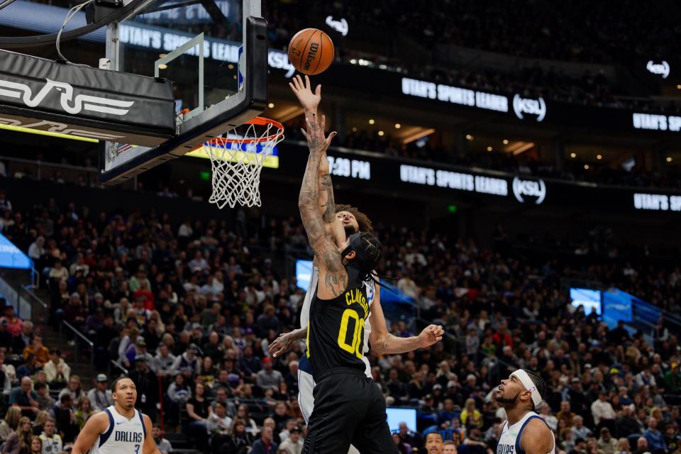 Utah Jazz guard Jordan Clarkson (00) shoots the ball with Dallas Mavericks center Dereck Lively II (2) on defense during the NBA basketball game between the Utah Jazz and the Dallas Mavericks at the Delta Center in Salt Lake City on Monday, Jan. 1, 2024. | Megan Nielsen, Deseret News