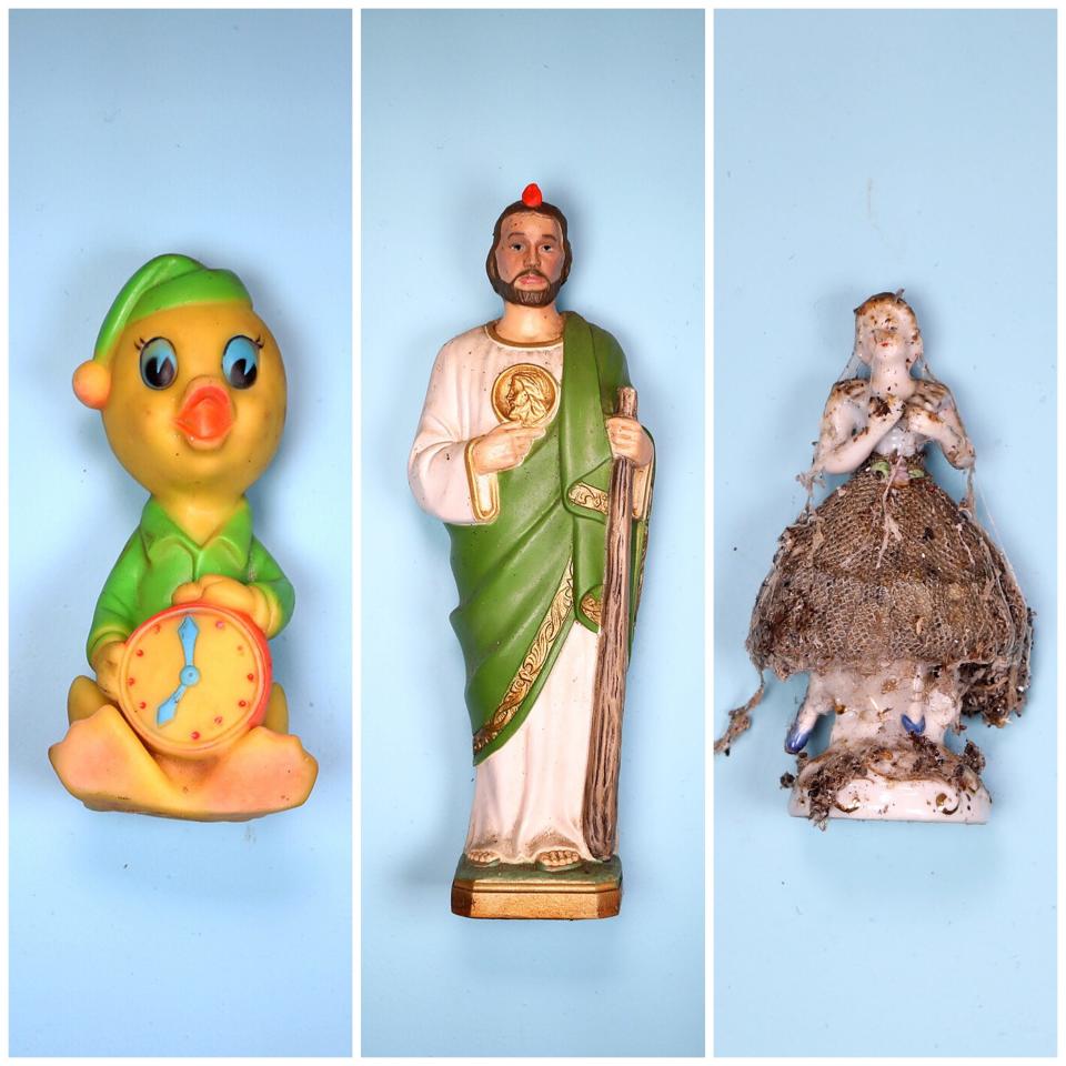 A few of the many items that belonged to Sally Honeycheck found in the filth and squalor of the Detroit home she was found dead in. Left: One of the many old and dirty dog toys found in boxes full of the toys that belonged to Jack, her Rottweiler who also died in the home. Middle: A statue of Jesus Christ found on a dirty dresser in a room with a mattress full of rat droppings. Sally was a devout Catholic. Right: One of two porcelain figurines found with lots of grime, dirt and cobwebs all over it. It was found on the ledge of a stained glass window in the front room of the home.