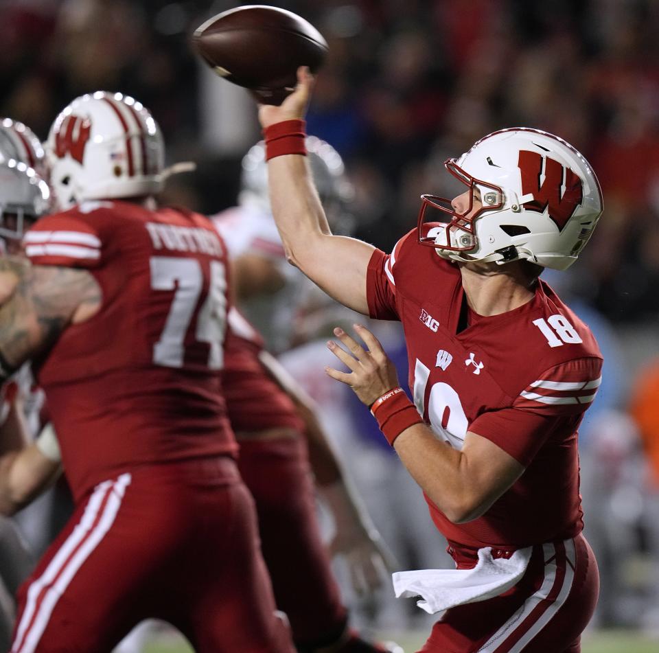 Wisconsin quarterback Braedyn Locke (18) throws a pass during the second quarter of their game against Ohio State Saturday, October 28, 2023 at Camp Randall Stadium in Madison, Wisconsin.