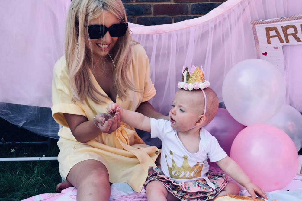 Poppy Stewart-Brown with her daughter Arabella on her first birthday, April 26 2020 (PA Real Life/Collect)