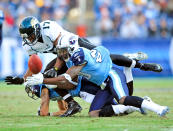 Alterraun Verner #20 and Jordan Babineaux #26 of the Tennessee Titans break up a pass intended for Chastin West #17 of the Jacksonville Jaguars during play at LP Field on December 24, 2011 in Nashville, Tennessee. The Titans won 23-17. (Photo by Grant Halverson/Getty Images)