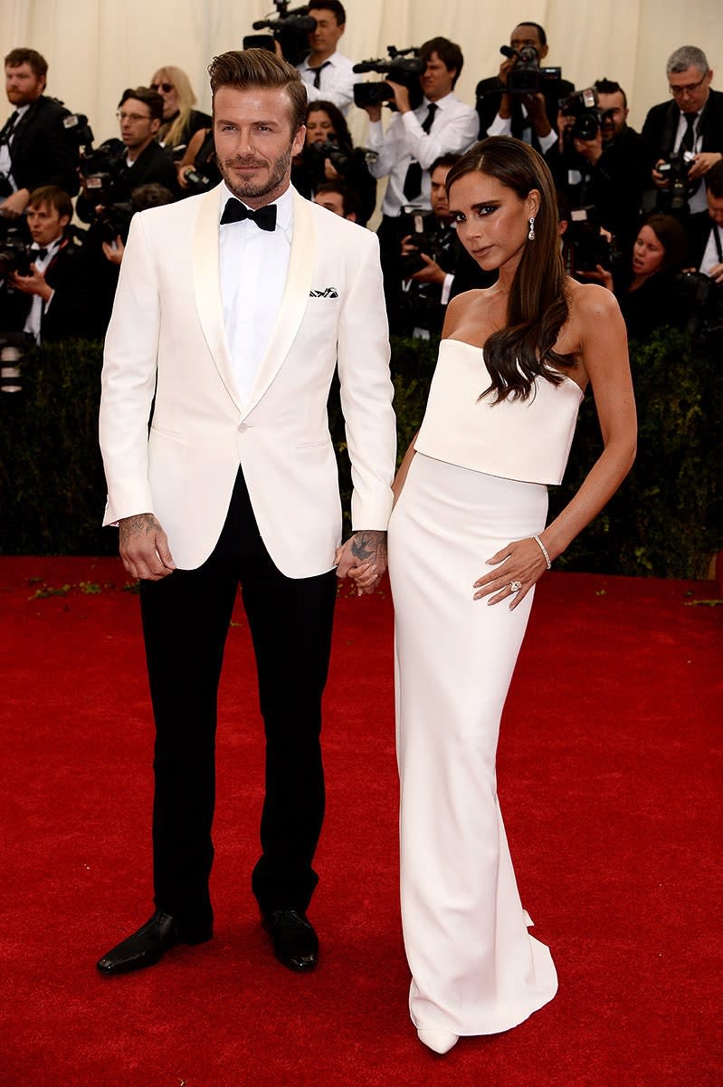 <h1 class="title">David Beckham in Ralph Lauren Black Label and Victoria Beckham in Victoria Beckham, 2014</h1><cite class="credit">Photo: Getty Images</cite>