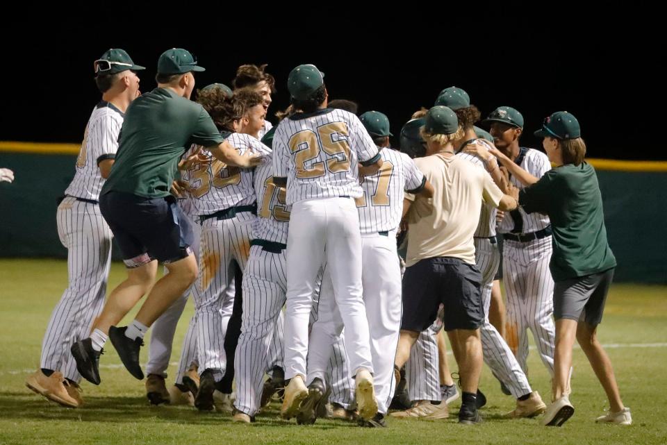 The Island Coast team celebrates after winning their game. Bonita Springs High School visited Island Coast for the Region 4A-4 Baseball quarterfinal matchup Wednesday, May 11, 2022 in Cape Coral. The Island Coast Gators defeated the bull sharks 10-0 and the game was called in the 5th inning.