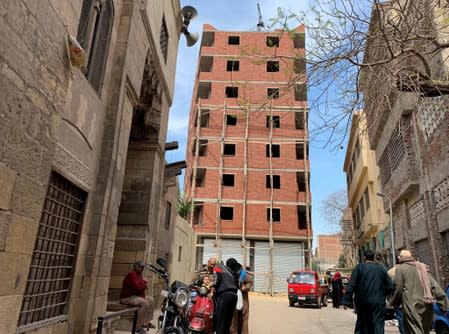 A new building is seen under construction in the historic neighbourhood of Darb al-Ahmar, in Cairo