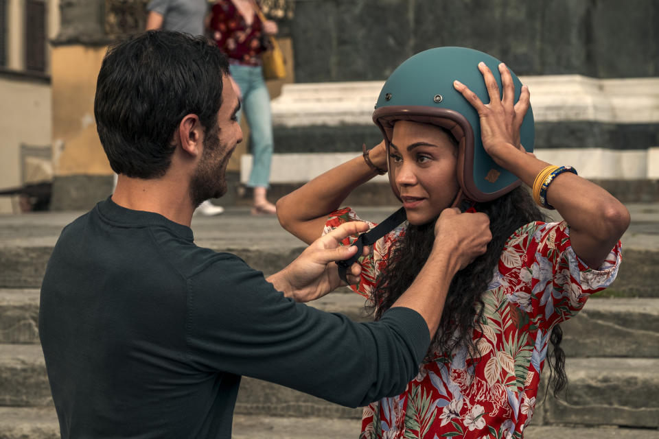 This image released by Netflix shows Eugenio Mastrandrea as Lino Ortolano, left, and Zoe Saldana as Amy Wheeler in a scene from "From Scratch." (Stefano Montesi/Netflix via AP)